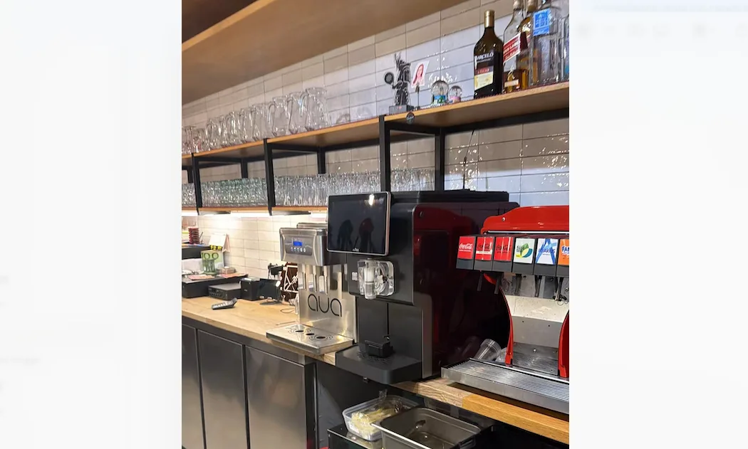 Huaxin Easy7 automatic soft serve machine installed on the back counter of a store in Spain